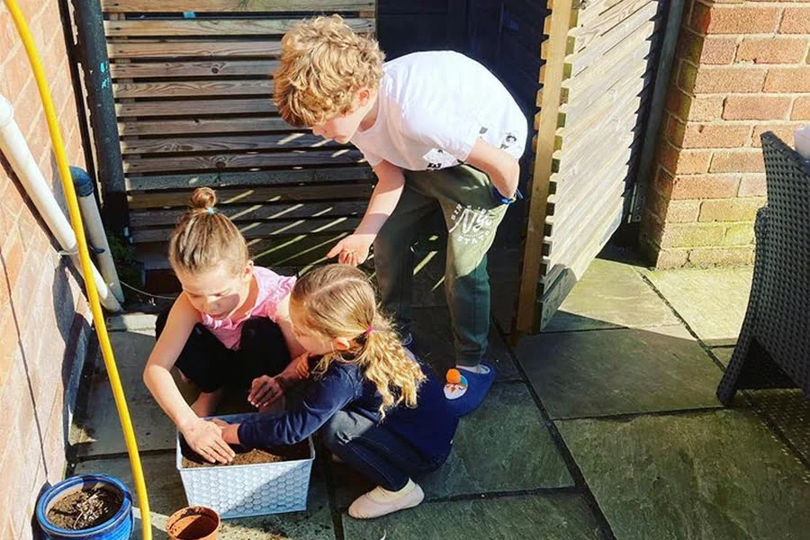 My children sowing wildflowers, excited to watch them germinate in the coming weeks and see them flower throughout the summer.